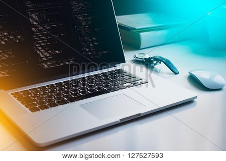 opened laptop, watch, mouse, books with gradient