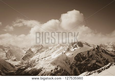View from ski on snowy mountains. Mountains Caucasus region Dombay. Toned landscape.