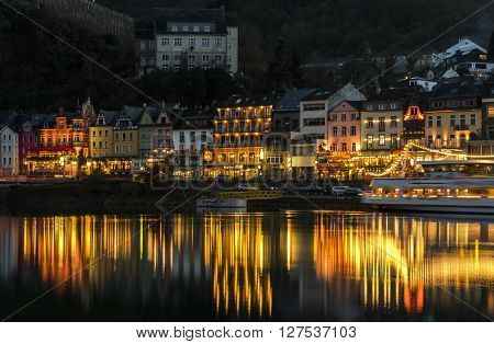 Cochem, Germany - March 28, 2016: Cochem at the Mossele in Germany at night with lights and a great castle Reichsburg