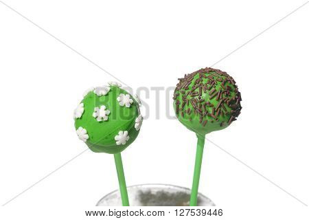 Two tasty colored cakepops on isolated background