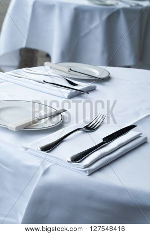 closeup photo of metal tableware in an outdoor restaurant