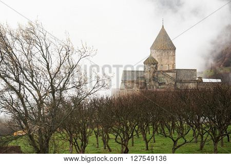 Ancient monastery Tatev covered with clouds in the mountains of Armenia. Was founded in year 906. 