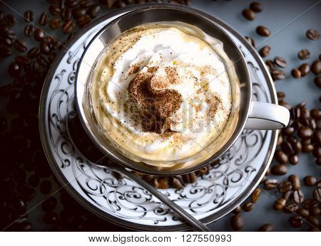 delocious coffee with whipped cream and cinnamon