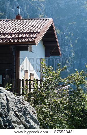 photo of a sunlit house at Piani d'Erna (part of the Alps) near Lake Como in Italy