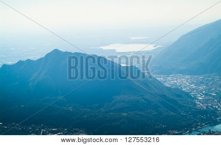 a lush green mountain photographed from Piani d'Erna (part of the Alps) near Lake Como in Italy
