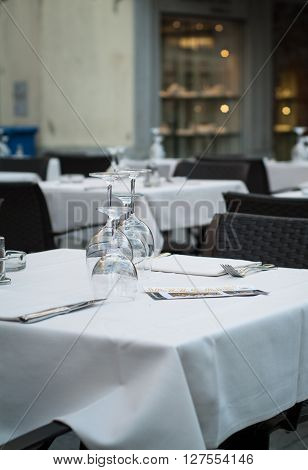 Lecco Italy - September 8th 2015: wine glasses beautifully arranged on a white table at a restaurant in Lecco an Italian town near Lake Como.