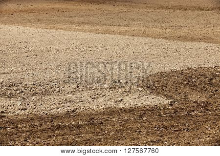 A Tractor Plowed Field Agricultural Land. Spring. Sown. Close-up.