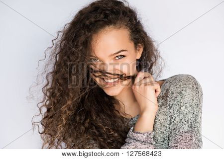 smile happy woman young curls beautiful on white background.