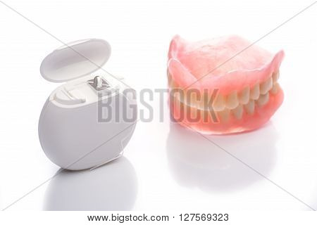 Teeth Model With Dental Floss On White Background