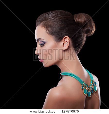 Beautiful Skinny Brunette Woman profile portrait. Beauty Luxury Makeup and Black Dress. Gorgeous Fashion Model Girl Portrait Isolated on a white background.
