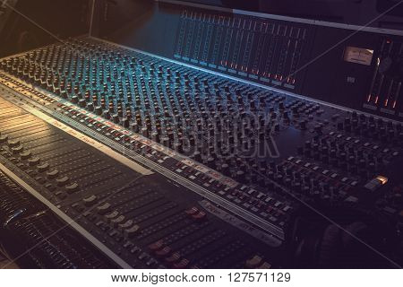 Sound recording equipment. Music mixer controls. Soft photo