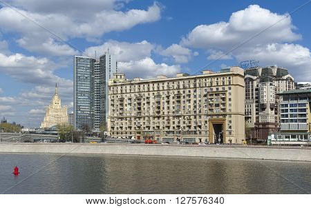 MOSCOW, RUSSIA - APRIL 24, 2016: View of the twelve-storey house of Stalinist architecture Novy Arbat 31/12 and the building of the Department of the media and advertising Moscow former Comecon Novy Arbat 36