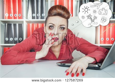Tired Bored Businesswoman Dreaming About Holiday In Office