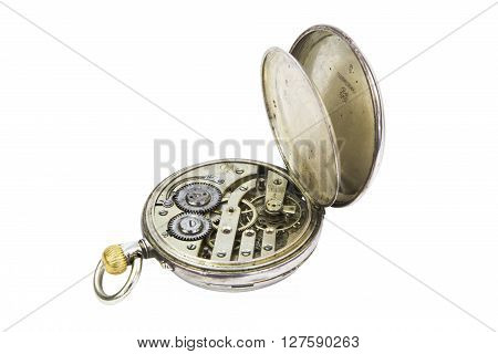 Old gold pocket watch mechanism isolated on white background