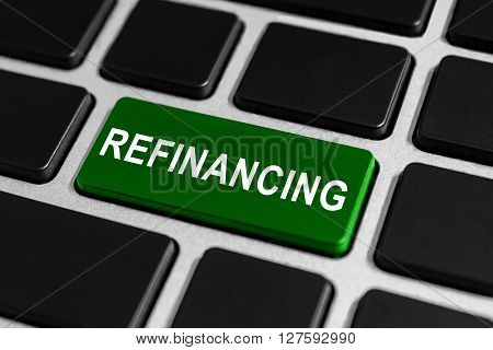 refinancing green button on keyboard business concept