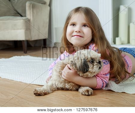happy girl with her dog at home