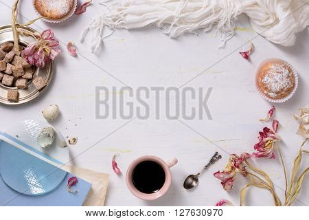 Cupcakes and coffee, morning light, food frame. Valentines or wedding day breakfast. Copy space, top view.