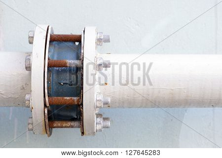 the pipeline connection by the joint with the rusty stud and bolt