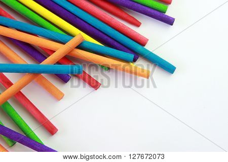 colorful sticks/ colorful wallpaper made up of wooden colored sticks.