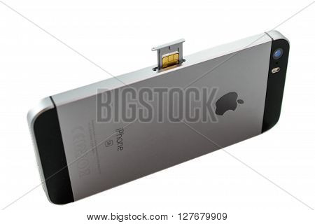 PARIS FRANCE - APR 21 2016: Instalation of the new SIM card in the new Apple iPhone SE combining the updated processor 4K rear camera touch id retina display