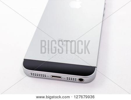 PARIS FRANCE - APR 21 2016: Rear view of the new Apple iPhone SE combining the updated processor 4K rear camera touch id retina display