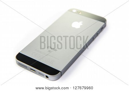 PARIS FRANCE - APR 21 2016: Rear view of the new Apple iPhone SE combining the updated processor 4K rear camera touch id retina display