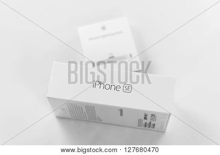 PARIS FRANCE - APR 21 2016: Packaging box of the new Apple iPhone SE combining the updated processor 4K rear camera touch id retina display and new Docking Station for iphone