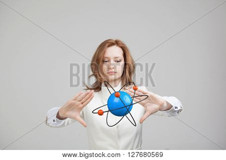 Woman scientist with atom model, research concept
