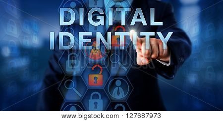Enterprise systems administrator is pushing DIGITAL IDENTITY on a visual touch screen. Information technology concept for information on a person application or device used by a computer system.