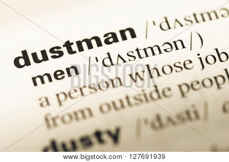 Close Up Of Old English Dictionary Page With Word Dustman.