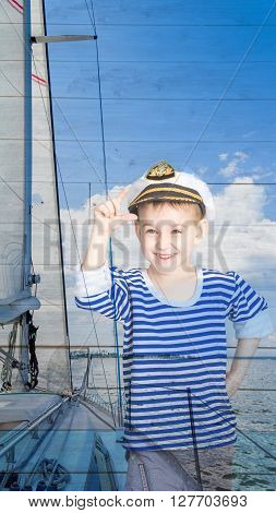 Double exposure a little boy seaman and yacht closeup