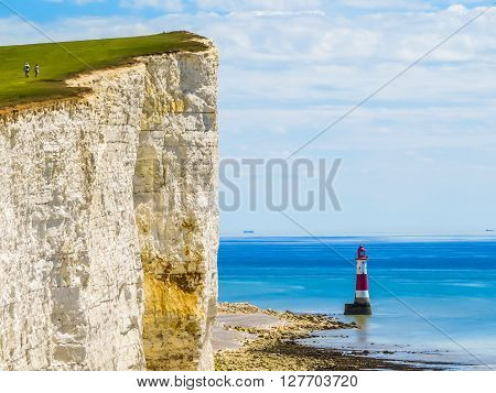 White chalk cliffs and Beachy Head Lighthouse. Eastbourne East Sussex England
