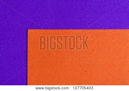 Eva foam ethylene vinyl acetate orange surface on purple sponge plush background