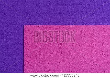 Eva foam ethylene vinyl acetate pink surface on purple sponge plush background