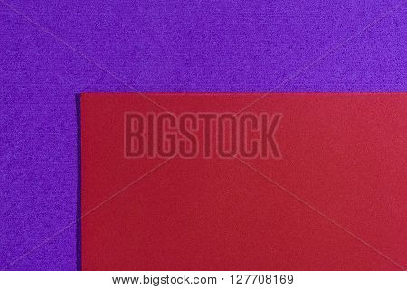 Eva foam ethylene vinyl acetate smooth red surface on purple sponge plush background