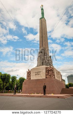 RIGA LATVIA - JULY 30: Guards standing in front of Freedom monument in Riga. July 2015
