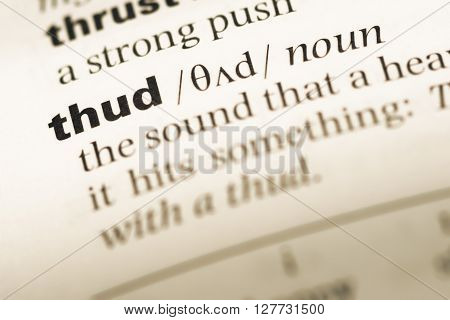 Close Up Of Old English Dictionary Page With Word Thud.