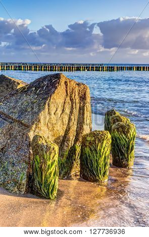 Wooden and rocky groynes on the coastline of the Baltic Sea Germany