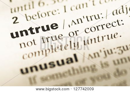 Close Up Of Old English Dictionary Page With Word Untrue.