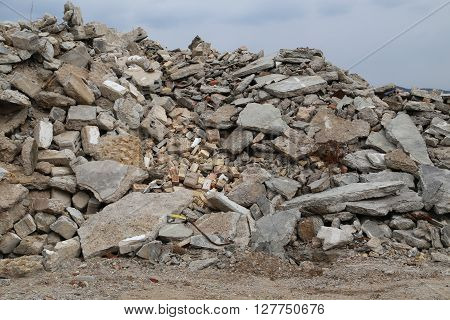 Overlooking a mountain of rubble of a demolished house