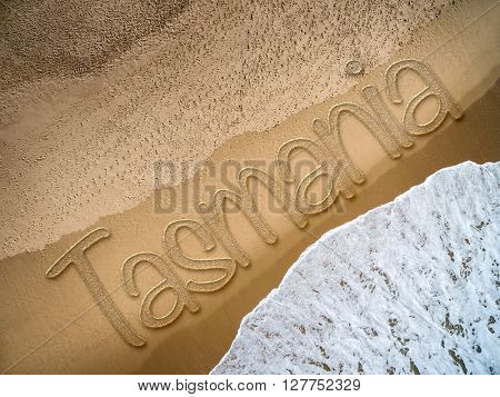 Tasmania written on the beach