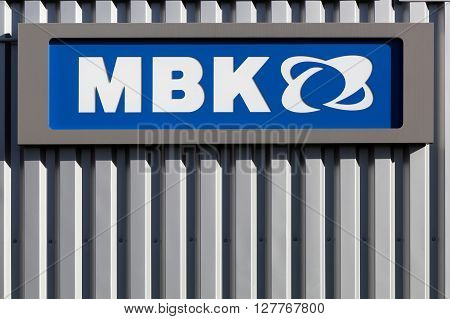 Villefranche, France - March 27, 2016: MBK logo on a wall. MBK a subsidiary of Yamaha Motor Company, is a french scooter manufacturer, based in Rouvroy, France.