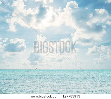 Horizon, blue ocean sky with sailing boat, vintage tone soft focus