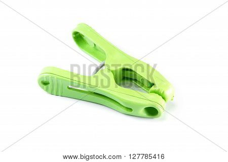 Closed up green clothespeg or clothespins isolated on white background