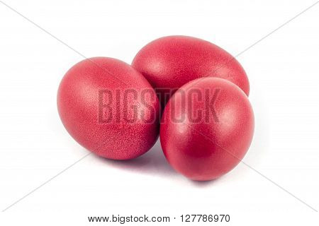 three red easter eggs isolated on white background.