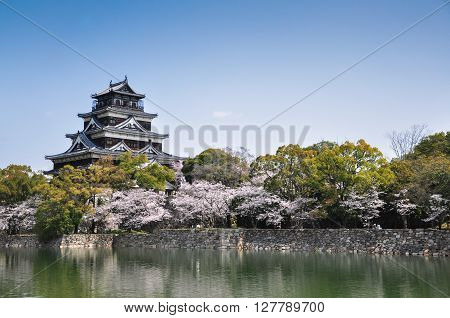 Hiroshima castle on the side of Otagawa river in spring
