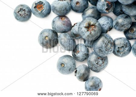 Ripe bilberry or blueberry over isolated white background