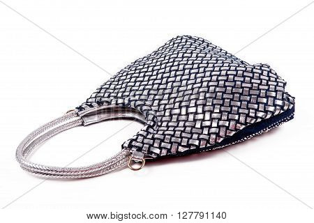 Grey shiny lady's bag with handles on a white background