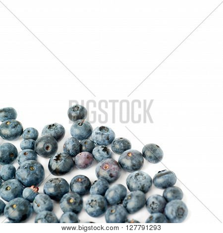 Pile of Ripe bilberry or blueberry over isolated white background