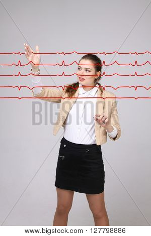 Doctor woman working with cardiogram lines